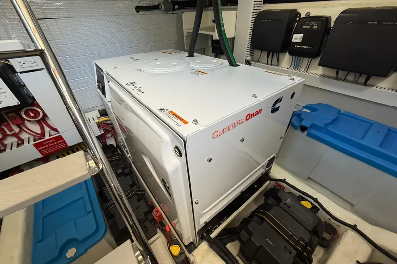 Slide: The Image of Engine room of 2013 Sabre 42 Salon Express with Cummins Onan generator. - 76