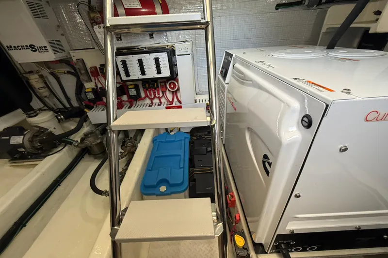 Slide: The Image of Engine room of 2013 Sabre 42 Salon Express with generator and control panel. - 77