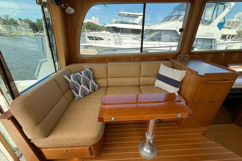 Slide: The Image of Interior of 2013 Sabre 42 Salon Express with cozy seating and wooden table. - 32