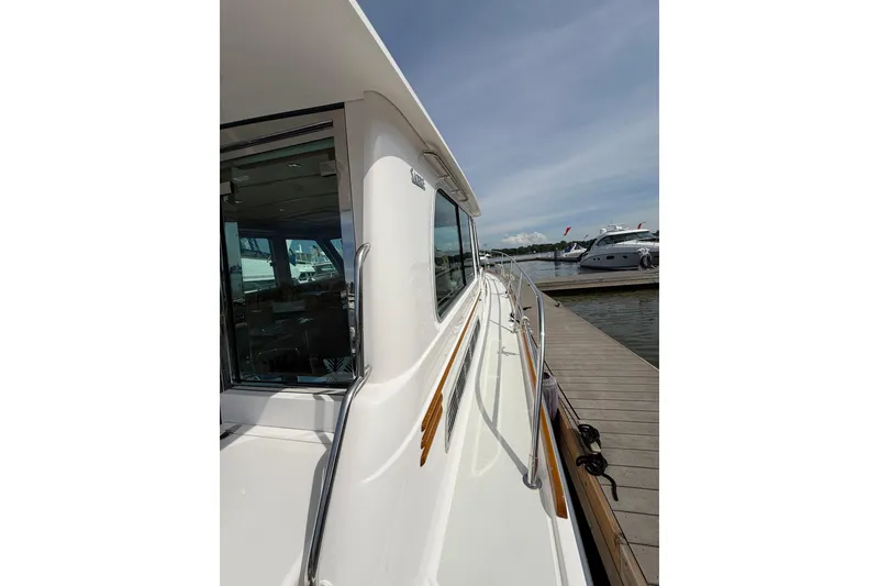 Slide: The Image of 2013 Sabre 42 Salon Express yacht docked at marina, side view. - 28