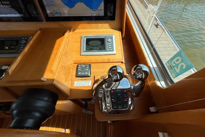 Slide: The Image of 2013 Sabre 42 Salon Express helm with controls and navigation display. - 46