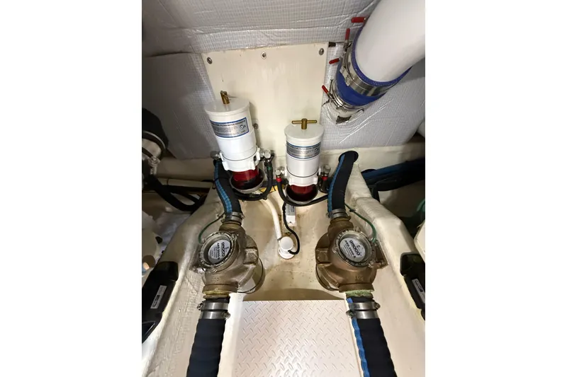 Slide: The Image of Engine room of 2013 Sabre 42 Salon Express with fuel filters and hoses. - 79