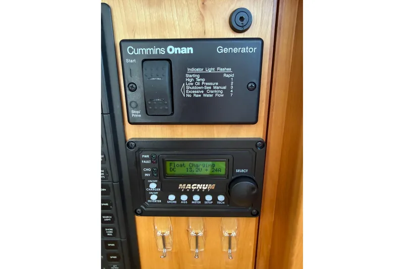 Slide: The Image of Control panel of a 2013 Sabre 42 Salon Express with Cummins Onan generator. - 50