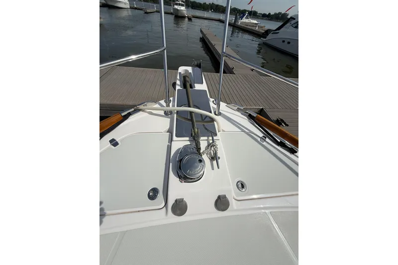 Slide: The Image of Bow view of 2013 Sabre 42 Salon Express yacht docked at marina. - 25