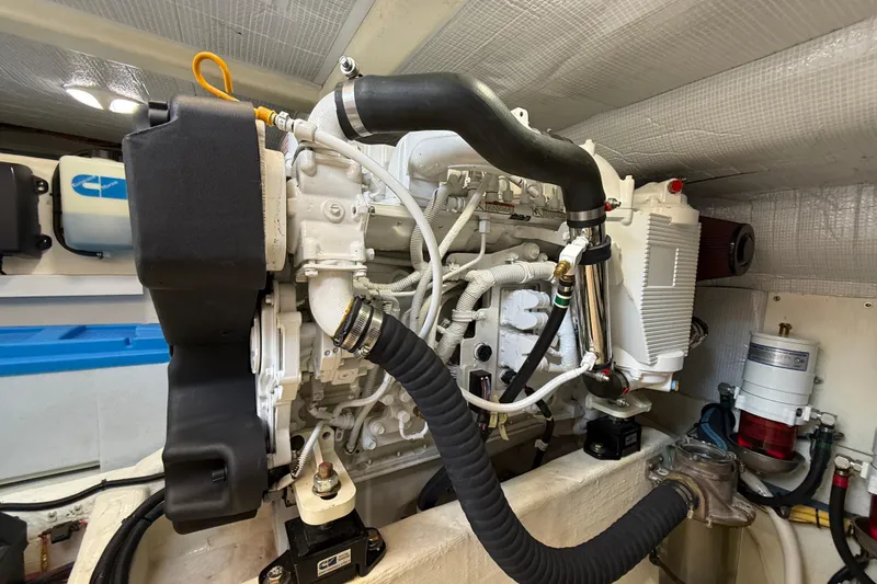 Slide: The Image of Engine room of 2013 Sabre 42 Salon Express, showcasing detailed mechanical components. - 73