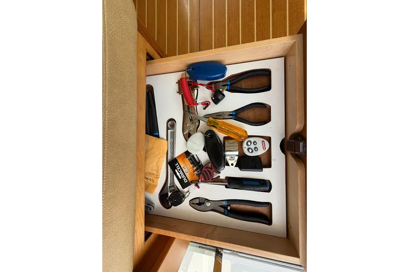 Slide: The Image of Drawer with tools and accessories on a 2013 Sabre 42 Salon Express boat. - 80