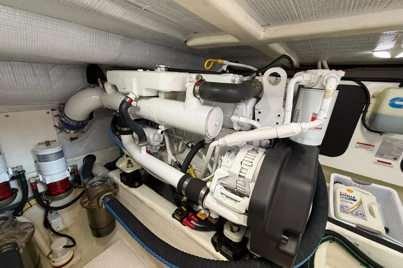 Slide: The Image of Engine room of 2013 Sabre 42 Salon Express, showcasing detailed mechanical components. - 75
