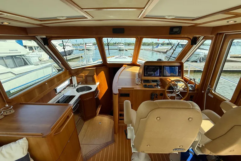 Slide: The Image of Interior of 2013 Sabre 42 Salon Express yacht with helm, seating, and kitchenette. - 39