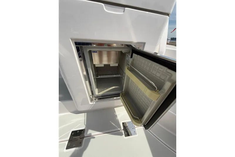 Slide: The Image of Open refrigerator on 2013 Sabre 42 Salon Express yacht, showcasing interior storage space. - 20