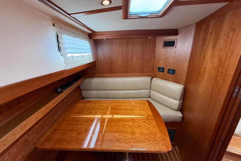 Slide: The Image of Luxurious interior of 2013 Sabre 42 Salon Express with elegant wood finish and cozy seating. - 65