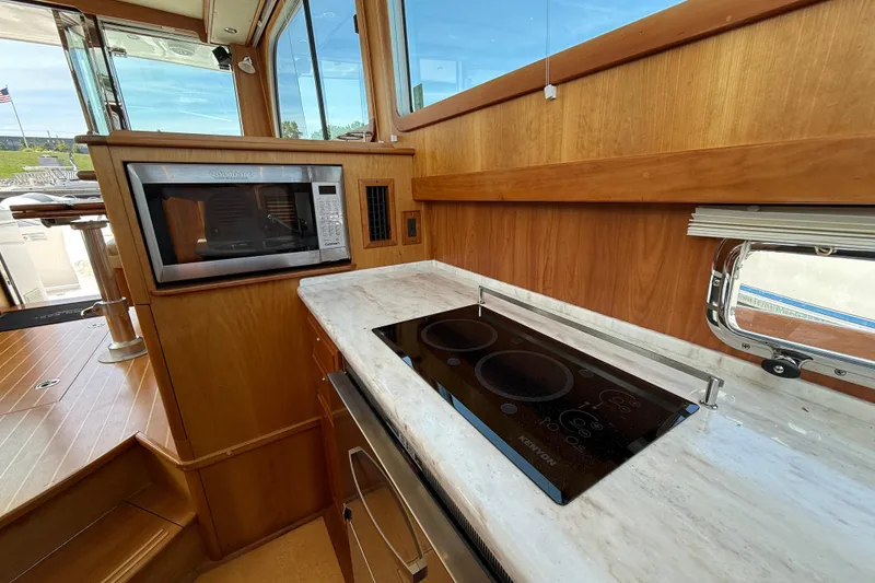Slide: The Image of Modern kitchen in 2013 Sabre 42 Salon Express yacht with stove and microwave. - 56