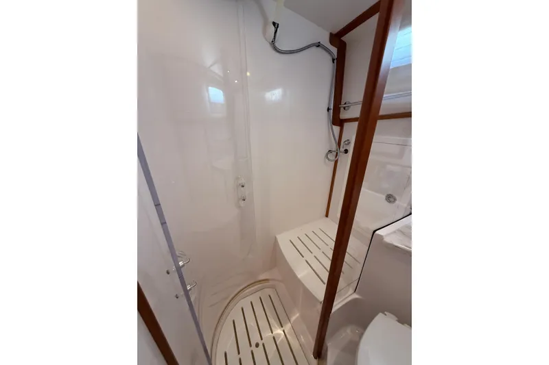Slide: The Image of Shower area in 2013 Sabre 42 Salon Express yacht, featuring wooden accents and modern fixtures. - 71