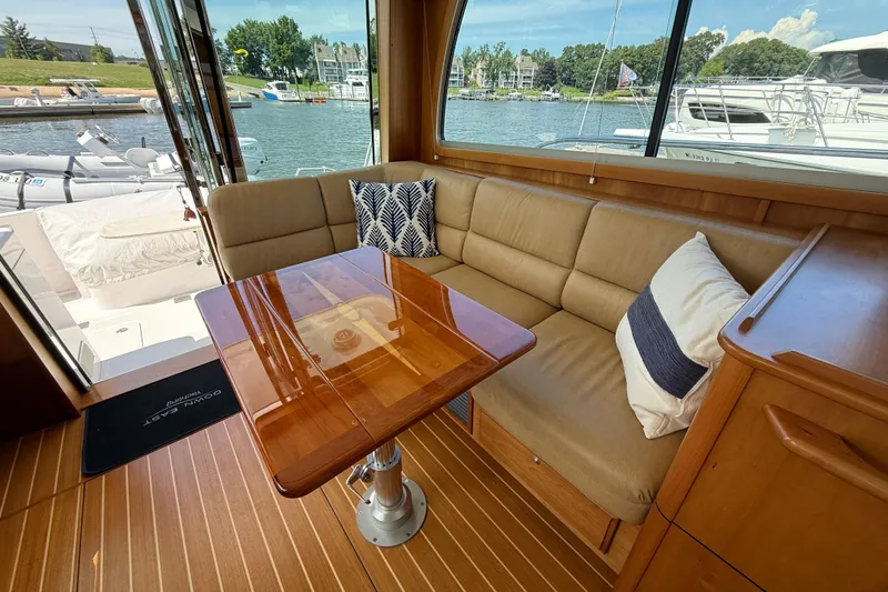 Slide: The Image of Luxurious interior of 2013 Sabre 42 Salon Express yacht with elegant seating and wooden table. - 36