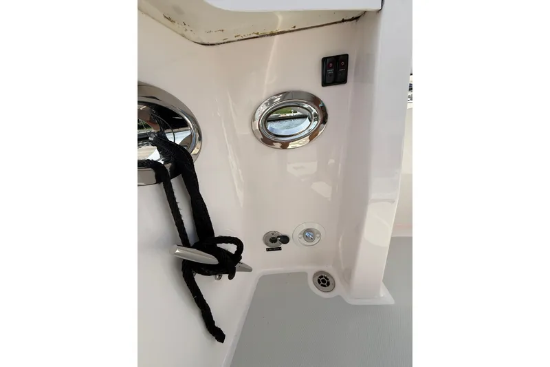 Slide: The Image of 2013 Sabre 42 Salon Express boat detail with cleat, rope, and control panel. - 29