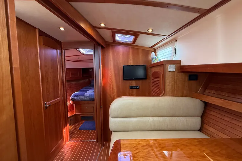 Slide: The Image of Interior of 2013 Sabre 42 Salon Express yacht with wood finish and cozy seating. - 66