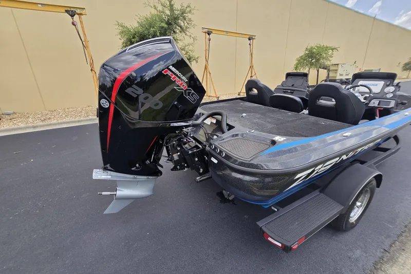 Slide: The Image of 2024 Nitro Z19 boat with Mercury Pro XS engine, parked on pavement. - 3