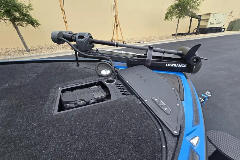 Slide: The Image of 2024 Nitro Z19 boat with Lowrance Ghost trolling motor and sleek black deck design. - 4