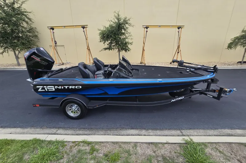 Slide: The Image of 2024 Nitro Z19 boat with sleek design, parked on a trailer outdoors. - 9