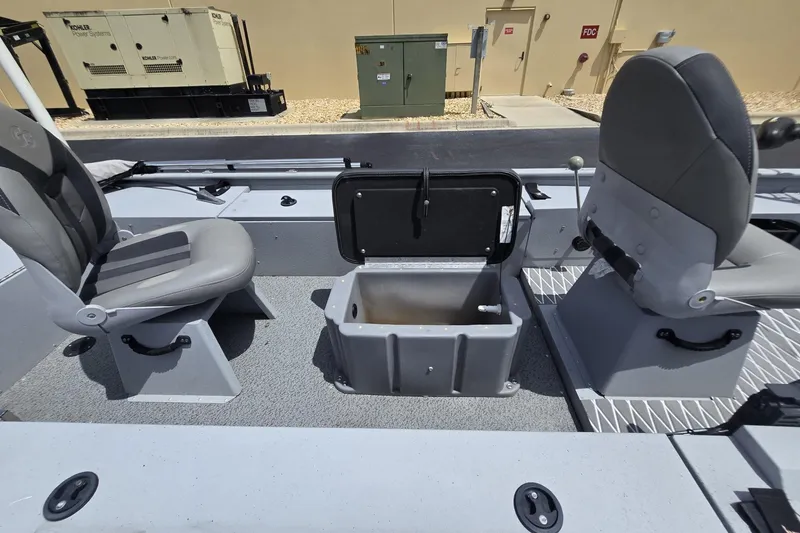 Slide: The Image of 2020 G3 Sportsman 1610 SS boat interior with seating and storage compartment. - 7