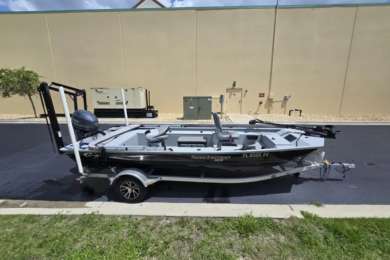 Slide: The Image of 2020 G3 Sportsman 1610 SS boat on trailer, parked outdoors. - 8