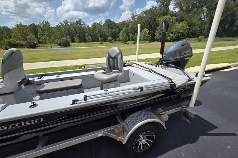 Slide: The Image of 2020 G3 Sportsman 1610 SS boat with Yamaha motor on trailer, parked outdoors. - 13