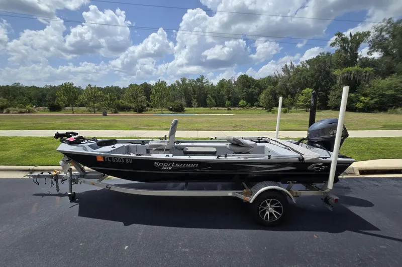 The Image of 2020 G3 Sportsman 1610 SS boat on trailer, parked outdoors under a cloudy sky. - 0