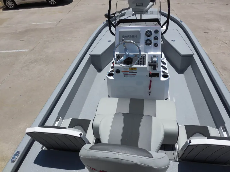 Slide: The Image of The image shows the cockpit of a Vexus ACX2000 boat with a Garmin display and gray seating. - 11