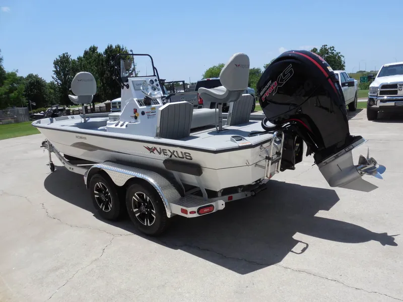 Slide: The Image of A 2026 Vexus ACX2000 boat on a trailer. It features a powerful outboard motor. - 5