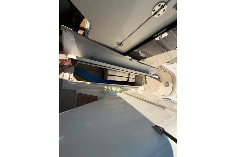 Slide: The Image of 2023 Chris-Craft Launch 28 GT boat storage compartment with open hatch. - 20