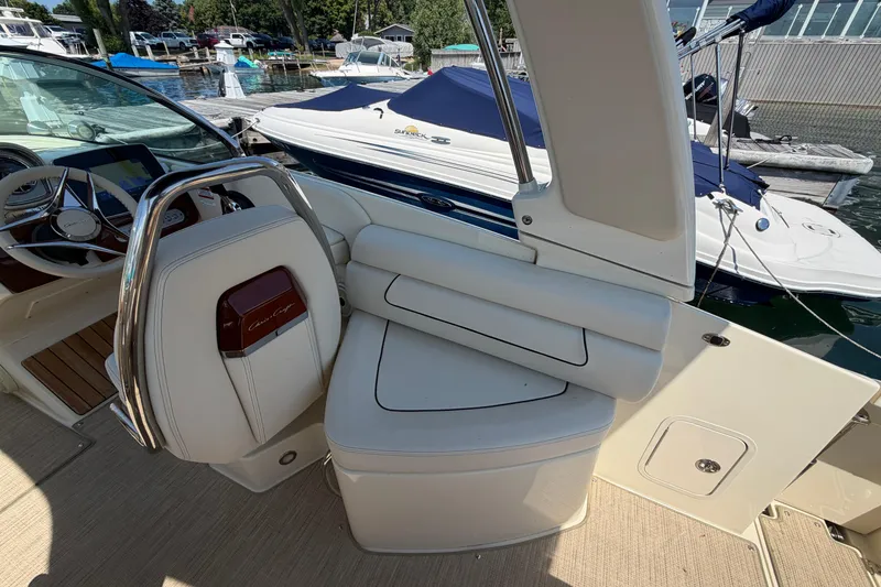 Slide: The Image of 2023 Chris-Craft Launch 28 GT interior with luxurious seating and steering wheel detail. - 6