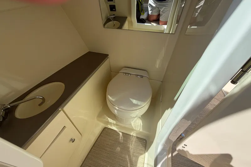 Slide: The Image of 2023 Chris-Craft Launch 28 GT boat bathroom with sink and toilet. - 10