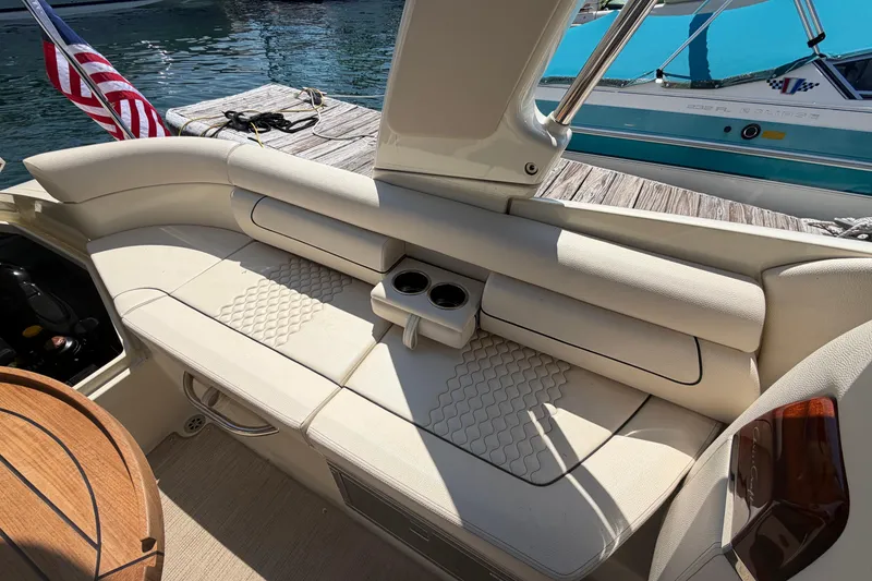 Slide: The Image of 2023 Chris-Craft Launch 28 GT boat interior with elegant seating and cup holders. - 25