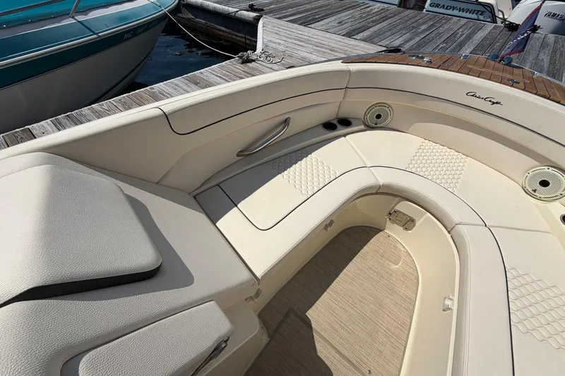 Slide: The Image of 2023 Chris-Craft Launch 28 GT boat interior with elegant seating and teak accents. - 15
