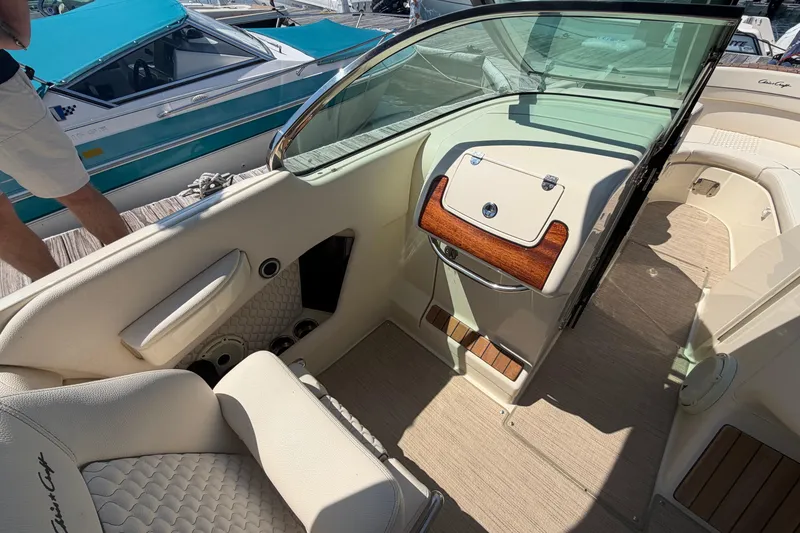 Slide: The Image of 2023 Chris-Craft Launch 28 GT interior with elegant seating and wood accents. - 8