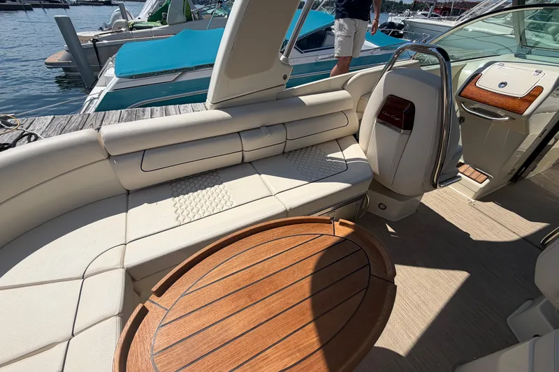 Slide: The Image of Luxurious interior of 2023 Chris-Craft Launch 28 GT boat with elegant seating and wooden table. - 5