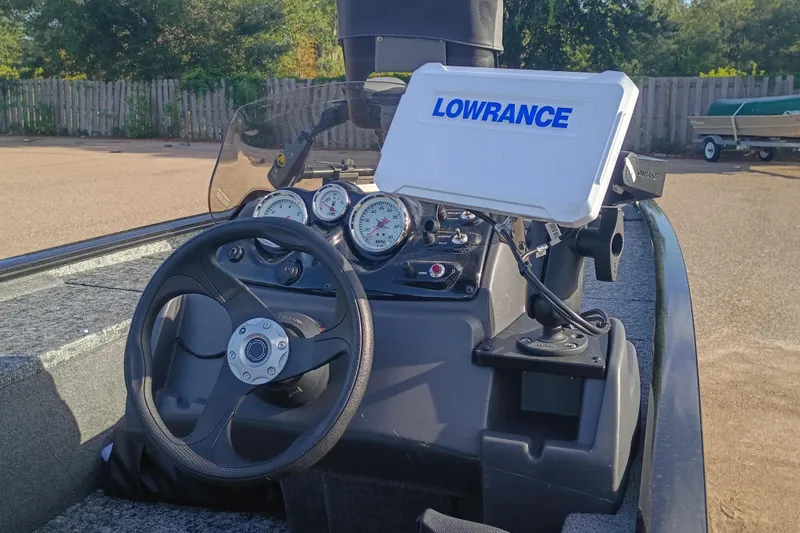 Slide: The Image of 2025 Tracker Pro 170 boat dashboard with Lowrance navigation system and gauges. - 3