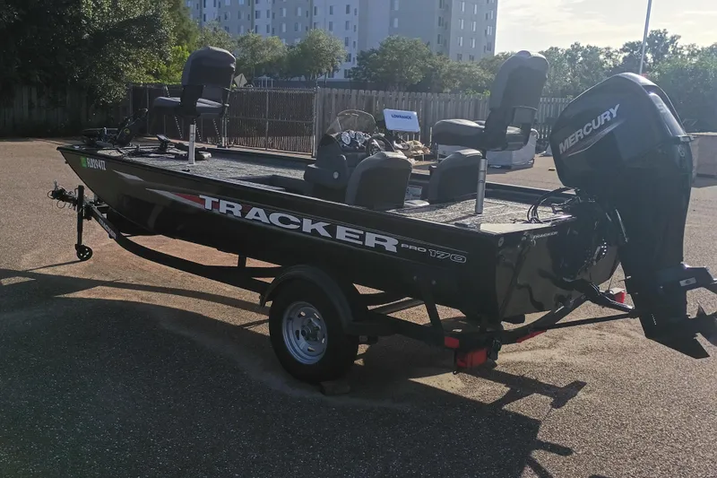 Slide: The Image of 2025 Tracker Pro 170 boat with Mercury engine on a trailer in a parking lot. - 5