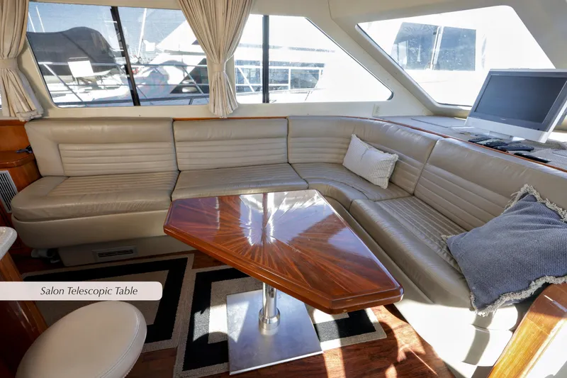 Slide: The Image of Luxurious 1996 Mediterranean convertible yacht interior with leather seating and telescopic table. - 22