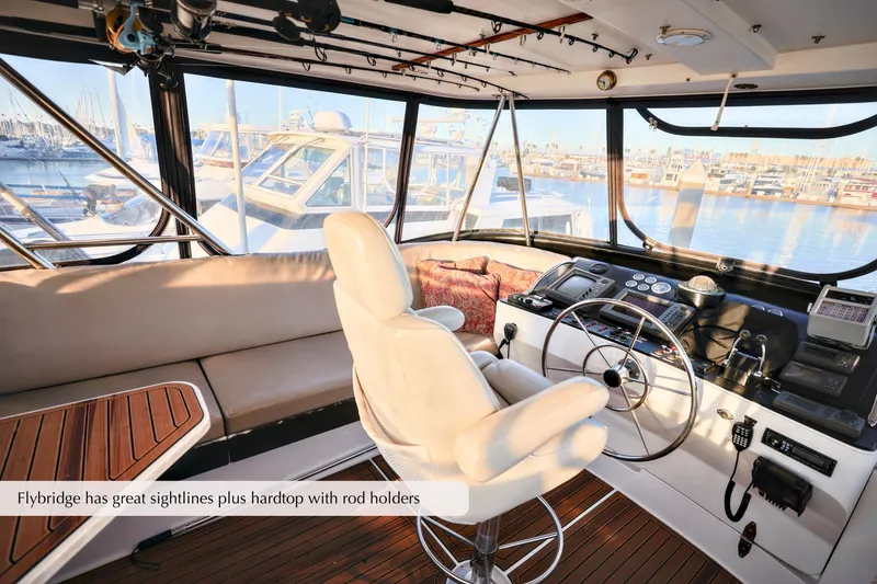 Slide: The Image of Interior of a 1996 Mediterranean convertible boat with flybridge and rod holders. - 17