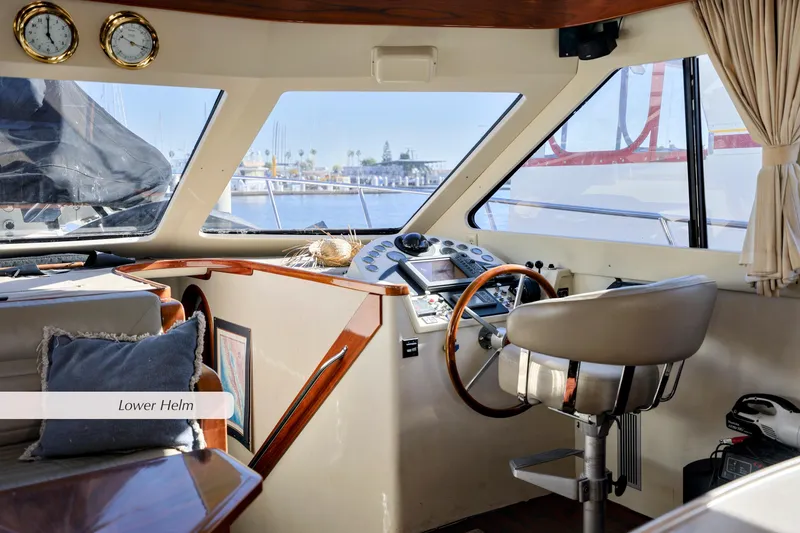 Slide: The Image of Lower helm of a 1996 Mediterranean convertible yacht with steering wheel and navigation instruments. - 21