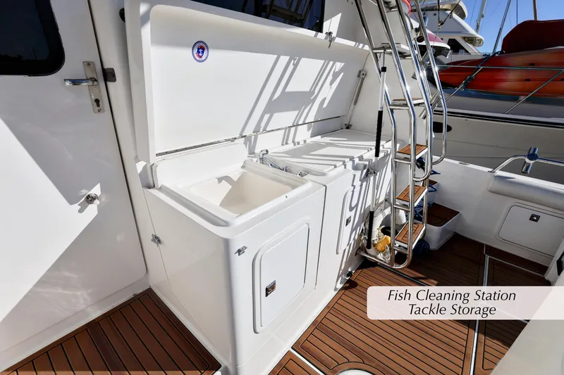 Slide: The Image of 1996 Mediterranean convertible boat with fish cleaning station and tackle storage on deck. - 7