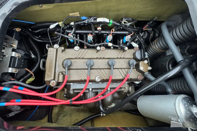 Slide: The Image of 2020 Kawasaki Jetski STX 160LX engine compartment with visible wiring and components. - 13