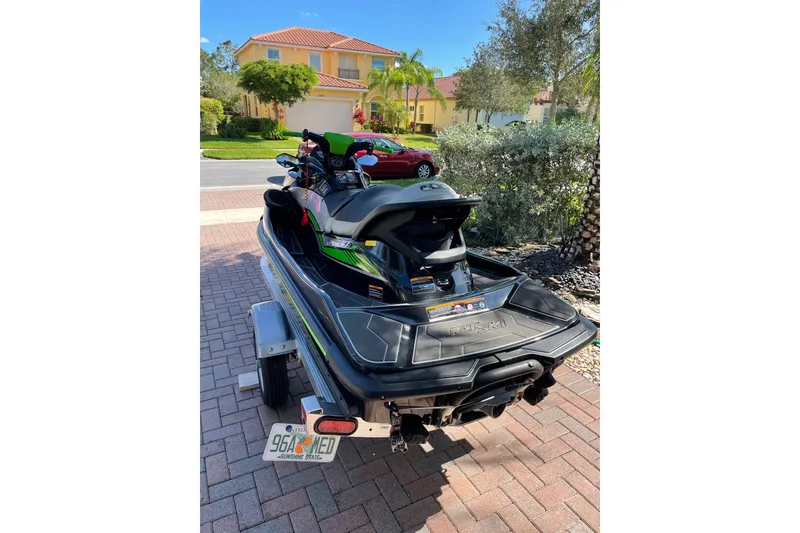 Slide: The Image of 2020 Kawasaki Jetski STX 160LX on trailer in suburban driveway. - 5