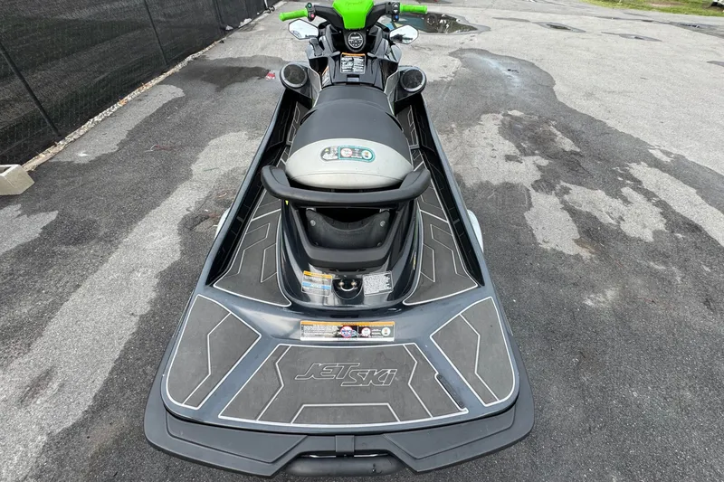 Slide: The Image of A 2020 Kawasaki Jetski STX 160LX sits on a paved area, ready for adventure. - 3