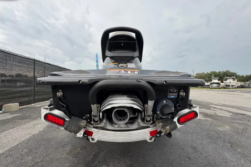 Slide: The Image of 2020 Kawasaki Jetski STX 160LX rear view, parked on asphalt, showcasing exhaust and taillights. - 8