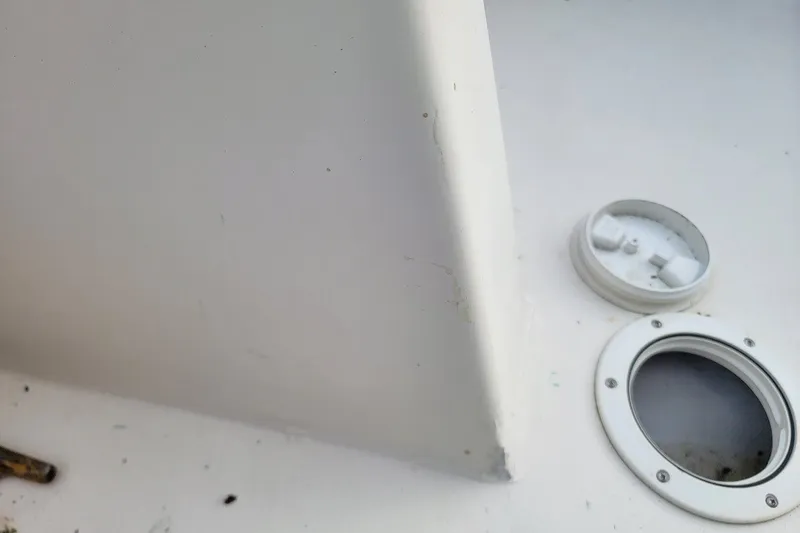 Slide: The Image of Close-up of a 1999 Custom Fiberglass Beetle Cat 12 boat deck with hatch detail. - 15