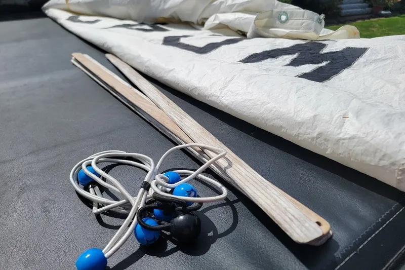 Slide: The Image of Sailing gear for Custom Fiberglass Beetle Cat 12, 1999 model, with ropes and sail. - 14
