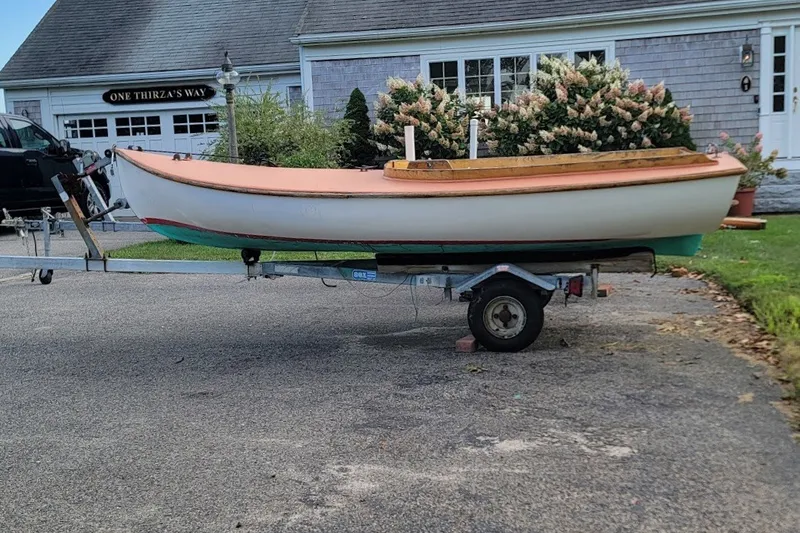 Slide: The Image of 1999 Custom Fiberglass Beetle Cat 12 sailboat on trailer in driveway. - 28