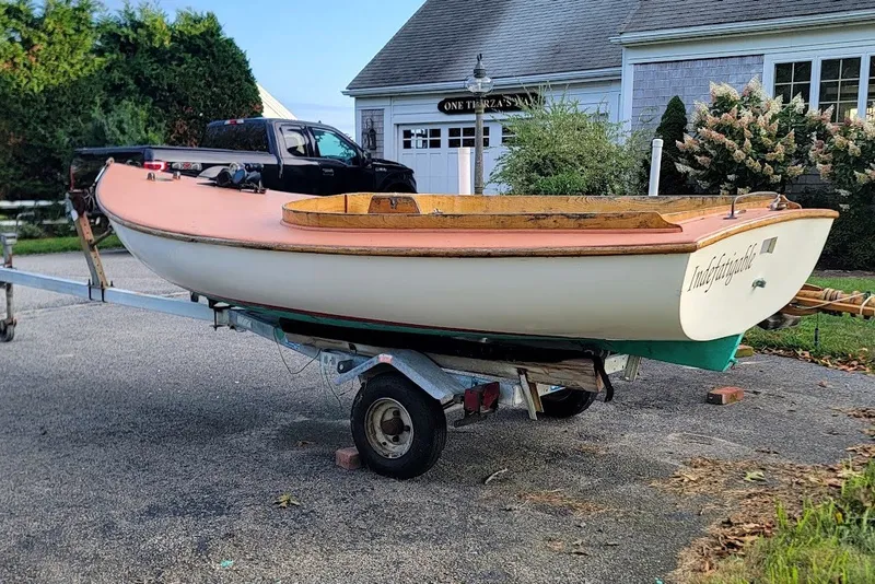 Slide: The Image of Custom 1999 Fiberglass Beetle Cat 12 sailboat on trailer, parked in residential driveway. - 25