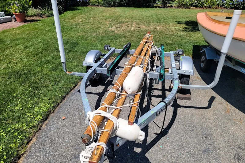 Slide: The Image of Trailer carrying wooden boat masts and buoys, Beetle Cat 14 Classic, 1999 model. - 5